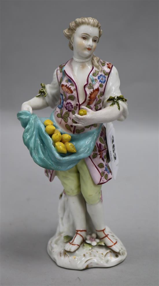 A 19th century German porcelain figure of a lemon seller (arm restored)